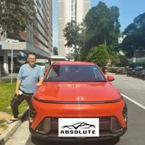Customer with a red Hyundai Kona