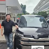 Customer collecting a Toyota Voxy